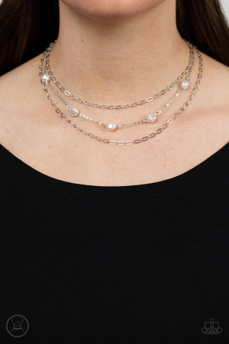 Infused with two oval-linked silver chains, imperfect white pearls adorn a dainty silver chain around the neck for a summery layered look. Features an adjustable clasp closure.  Sold as one individual choker necklace. Includes one pair of matching earrings.