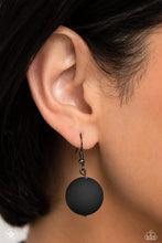 Load image into Gallery viewer, Single black bead hanging from a gunmetal fish hook earring.
