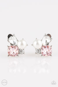 Featuring a classic pearl, mismatched pink and white rhinestones join into a radiant frame. Earring attaches to a standard clip-on fitting.  Sold as one pair of clip-on earrings.