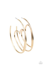 Load image into Gallery viewer, Glistening gold wire delicately bends into an airy heart frame inside a classic gold hoop, creating a flirtatious display. Earring attaches to a standard post fitting. Hoop measures approximately 2&quot; in diameter.  Sold as one pair of hoop earrings.

