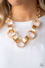 Load image into Gallery viewer, Etched in linear patterns, dramatically oversized gold links connect below the collar for a bold statement-making look. Features an adjustable clasp closure. Sold as one individual necklace. Includes one pair of matching earrings.
