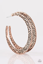 Load image into Gallery viewer, Delicately hammered in shimmery textures, a glistening copper hoop curls around the ear for a fierce fashion. Earring attaches to a standard post fitting. Hoop measures 2&quot; in diameter. Sold as one pair of hoop earrings.

