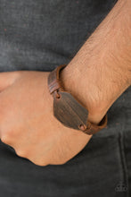 Load image into Gallery viewer, An imperfect piece of leather is knotted in place around a distressed brown leather band for a rugged look. Features an adjustable snap closure. Sold as one individual bracelet.
