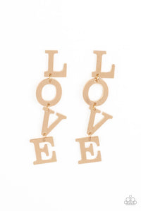 Gold letters with a lightly hammered sheen spell out the word "LOVE" as they vertically cascade down the ear in a flattering finish. Each of the letters are interconnected to one another giving the piece some whimsically playful movement. Earring attaches to a standard post fitting.  Sold as one pair of post earrings.