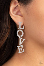 Load image into Gallery viewer, Gold letters with a lightly hammered sheen spell out the word &quot;LOVE&quot; as they vertically cascade down the ear in a flattering finish. Each of the letters are interconnected to one another giving the piece some whimsically playful movement. Earring attaches to a standard post fitting.  Sold as one pair of post earrings.
