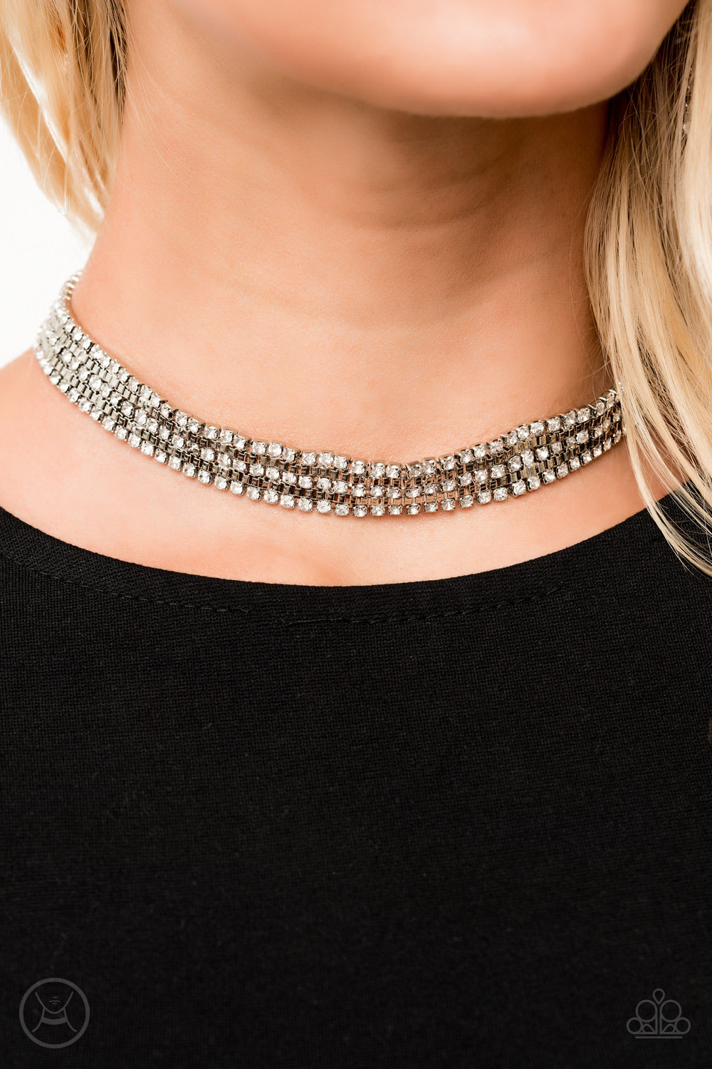 Featuring sleek square fittings, strands of glittery white rhinestones connect with rows of silver box chain around the neck for a glittery twist. Features an adjustable clasp closure.  Sold as one individual choker necklace. Includes one pair of matching earrings.