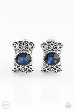 Load image into Gallery viewer, Brushed in an antiqued shimmer, vine-like filigree climbs into a glistening silver hoop. A glittery blue rhinestone is pressed into the top of the frame for a regal finish. Earring attaches to a standard clip-on fitting.  Sold as one pair of clip-on earrings.
