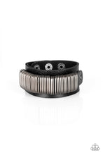 Load image into Gallery viewer, Antiqued silver rings slide along a black leather band, studded across the front of a thicker black leather band for a rustic look. Features an adjustable snap closure.  Sold as one individual bracelet.
