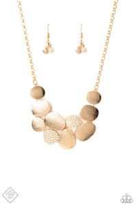 A collection of asymmetrical oval discs connect into a clustered pendant below the collar for a refined flair. Etched linear textures or white rhinestones adorn each disc, offering a gorgeous collision of texture, sheen, and sparkle. Features an adjustable clasp closure. Includes one pair of matching earrings