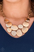 Load image into Gallery viewer, A collection of asymmetrical oval discs connect into a clustered pendant below the collar for a refined flair. Etched linear textures or white rhinestones adorn each disc, offering a gorgeous collision of texture, sheen, and sparkle. Features an adjustable clasp closure. Includes one pair of matching earrings
