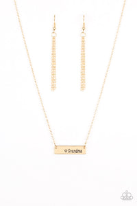 A shimmery gold frame stamped with the word, "Grandma", is suspended horizontally below the collar for a sentimental fashion. Features an adjustable clasp closure.  Sold as one individual necklace. Includes one pair of matching earrings.