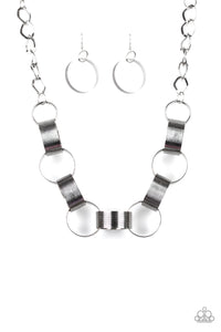 Etched in linear patterns, dramatically oversized silver links connect below the collar for a bold statement-making look. Features an adjustable clasp closure.  Sold as one individual necklace. Includes one pair of matching earrings.