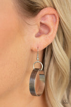 Load image into Gallery viewer, Silver circle hanging from a fish hook earring.
