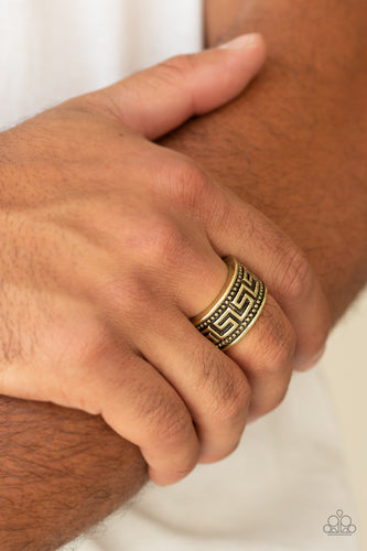 A thick brass band is studded and embossed in a tribal inspired pattern for an edgy look. Features a stretchy band for a flexible fit.  Sold as one individual ring.