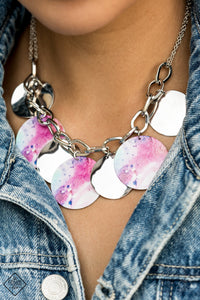 Featuring a galactic tie dye print, flat colorful discs swirled in tones of blue and purple combine with curved silver discs, swinging from the bottom of a bulky silver chain for a trendy throwback look. Features an adjustable clasp closure. Includes one pair of matching earrings.