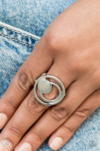 A solid silver disc and airy silver hoops eclipse across the finger, delicately coalescing into an edgy offset frame. Features a stretchy band for a flexible fit.