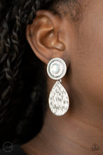 Load image into Gallery viewer, A hammered silver teardrop dangles from the bottom of an ornate silver disc that is dotted with a dreamy opal beaded center. Earring attaches to a standard clip-on fitting. Sold as one pair of clip-on earrings.
