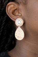 Load image into Gallery viewer, A hammered rose gold teardrop dangles from the bottom of an ornate rose gold disc that is dotted with a dreamy opal beaded center. Earring attaches to a standard clip-on fitting.  Sold as one pair of clip-on earrings.
