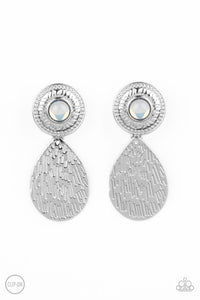 A hammered silver teardrop dangles from the bottom of an ornate silver disc that is dotted with a dreamy opal beaded center. Earring attaches to a standard clip-on fitting.  Sold as one pair of clip-on earrings.