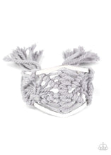 Load image into Gallery viewer, Ash cording decoratively knots and weaves around an airy silver cuff for a macramé inspired look. Knotted around the ends, Ash tassels flair out from the bottoms of the cuff for a wanderlust finish.  Sold as one individual bracelet.
