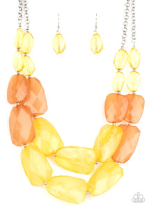 Varying in shape and size, opaque yellow and brown crystal-like beads delicately link into two colorfully icy layers below the collar for a stunning statement-making finish. Features an adjustable clasp closure.  Sold as one individual necklace. Includes one pair of matching earrings.