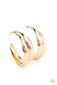 Two thick gold bars delicately overlap into a boldly oversized hoop. Earring attaches to a standard post fitting. Hoop measures approximately 2" in diameter.  Sold as one pair of hoop earrings.