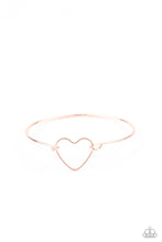 Load image into Gallery viewer, A dainty rose gold heart frame attaches to a dainty rose gold bangle-like cuff, creating a flirty centerpiece around the wrist. Features a toggle closure.  Sold as one individual bracelet.
