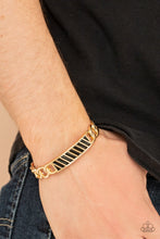 Load image into Gallery viewer, Gold chain-like bars attach to a riveted gold centerpiece, creating a statement-making cuff around the wrist.  Sold as one individual bracelet.
