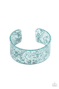 Dainty silvery shavings are encased in a thick blue acrylic cuff, creating an icy incandescence around the wrist.  Sold as one individual bracelet.