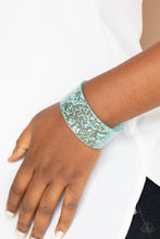 Load image into Gallery viewer, Dainty silvery shavings are encased in a thick blue acrylic cuff, creating an icy incandescence around the wrist.  Sold as one individual bracelet.
