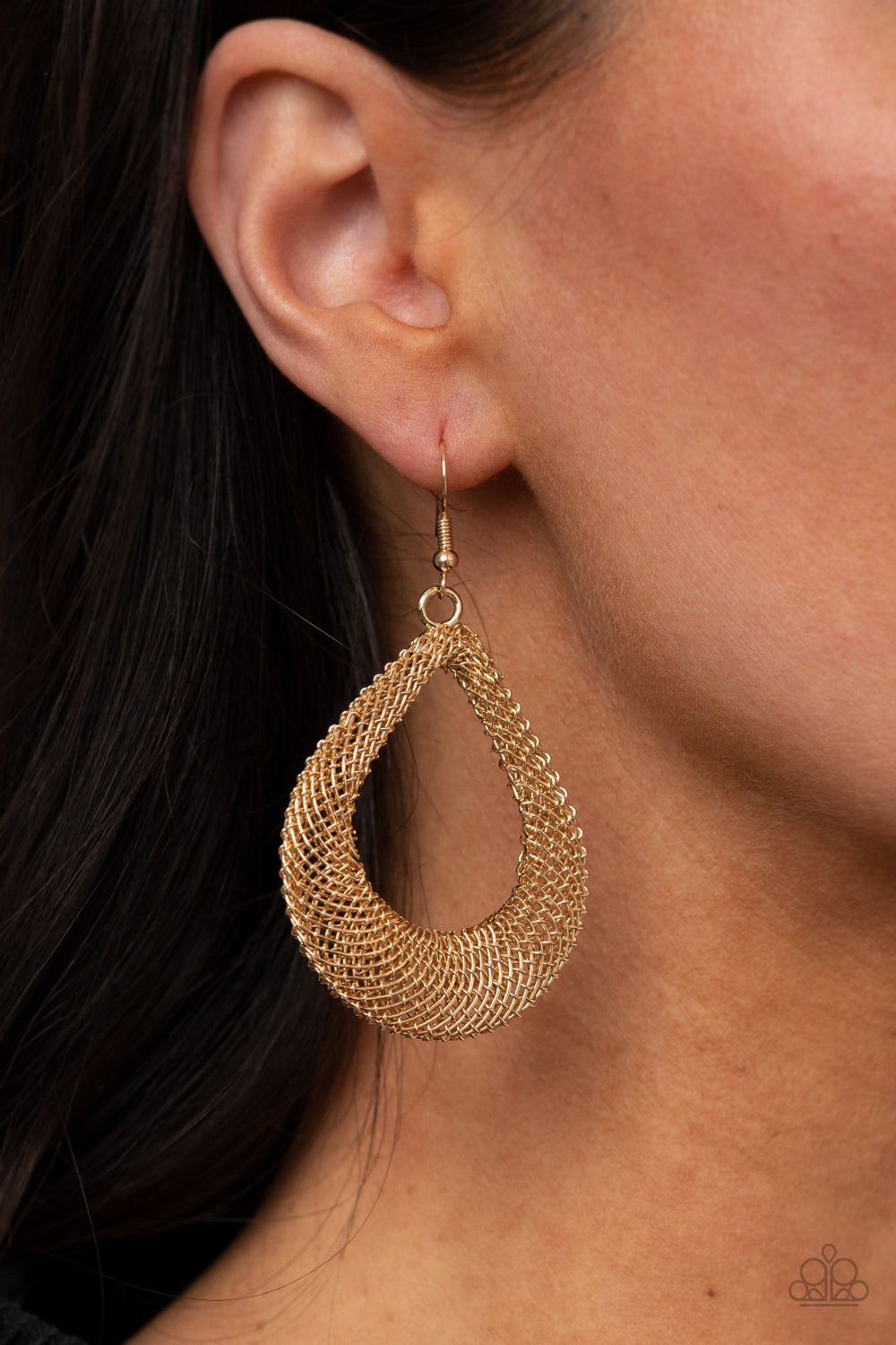 Mesh-like gold chain frames delicately attach into a 3-dimensional teardrop, creating an intense industrial display. Earring attaches to a standard fishhook fitting.  Sold as one pair of earrings.