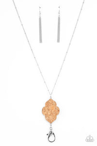 A scalloped cork frame is pressed into a sleek silver frame at the bottom of a dainty silver satellite chain. A lobster clasp hangs from the bottom of the design to allow a name badge or other item to be attached. Features an adjustable clasp closure.  Sold as one individual lanyard. Includes one pair of matching earrings.