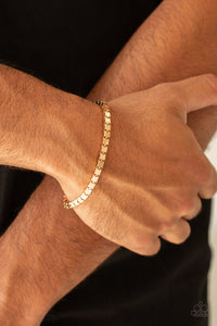 A thick strand of glistening gold box chain links around the wrist for a bold look. Features an adjustable clasp closure.