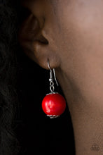Load image into Gallery viewer, Red wooden bead dangling from a silver fish hook earring.
