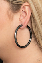 Load image into Gallery viewer, A thick gunmetal bar delicately curls into a glistening oversized hoop for a retro look. Earring attaches to a standard post fitting. Hoop measures approximately 2 1/4&quot; in diameter.  Sold as one pair of hoop earrings.
