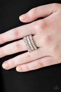 Featuring refined marquise cuts, glittery pink rhinestones flare from a center of glassy white rhinestones, creating a regal band across the finger. Features a stretchy band for a flexible fit. Sold as one individual ring.