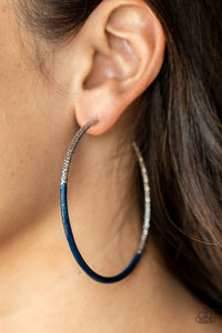 Featuring faceted diamond cut texture, a shimmery silver hoop is dipped in Rhodonite paint for a colorful flair. Earring attaches to a standard post fitting. Hoop measures approximately 2 3/4" in diameter.  Sold as one pair of hoop earrings.
