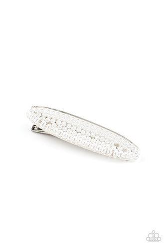 A classic collection of dainty white pearls is encased inside an oval acrylic frame, creating a refined centerpiece atop a silver hair clip. Features a standard hair clip on the back.  Sold as one individual hair clip.