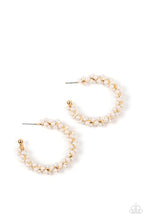Load image into Gallery viewer, A dainty strand of white pearls is delicately wrapped around a classic gold hoop, creating bubbly refinement. Earring attaches to a standard post fitting. Hoop measures approximately 1 1/2&quot; in diameter.  Sold as one pair of hoop earrings.
