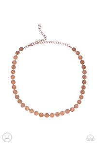 Delicately scratched in a blinding shimmer, a row of dainty copper discs shines around the neck for a minimalistic sheen. Features an adjustable clasp closure.  Sold as one individual choker necklace. Includes one pair of matching earrings.