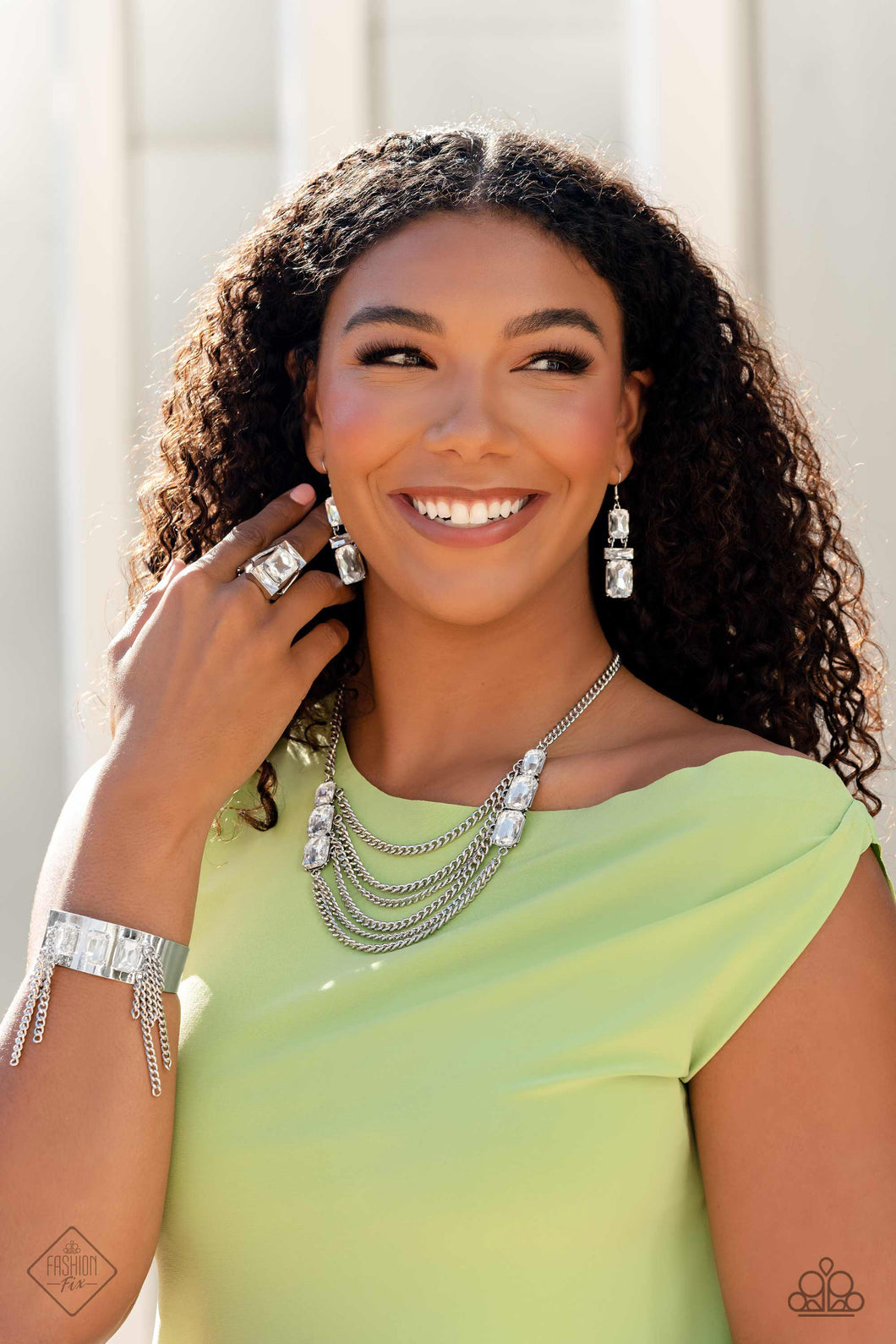 Necklace set including earrings, ring and bracelet displayed on a Model.