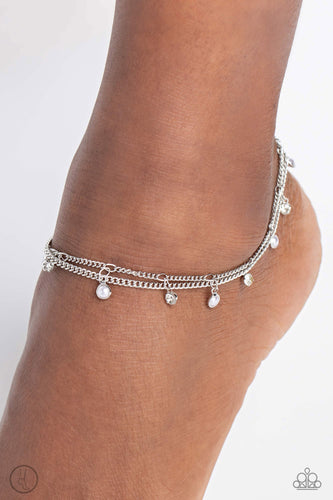 A fringe of dainty pearls and white gems pressed into sleek silver frames wraps around the ankle on a dainty silver chain, creating a glittery, oceanic statement. A second dainty silver chain adds a high-sheen layer for a refined finish. Features an adjustable clasp closure.  Sold as one individual anklet.