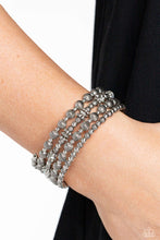 Load image into Gallery viewer, Coiling around the wrist, striped silver beads of varying sizes, interacts with silver accents, silver wheel beads, and silver discs for an eye-catching, endless, monochromatic design.  Sold as one individual bracelet.
