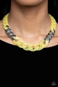 Brushed in a vibrant Empire Yellow finish, a strand of acrylic curb chain combines with links of a silver curb chain to dramatically drape across the chest for a whimsical yet bold look. Features an adjustable clasp closure.  Sold as one individual necklace. Includes one pair of matching earrings.