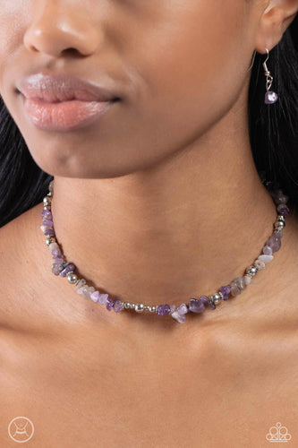 Infused along an invisible string, a chiseled collection of amethyst stones and various silver beads wrap around the collar for an earthy pop of color. Features an adjustable clasp closure. As the stone elements in this piece are natural, some color variation is normal.  Sold as one individual choker necklace. Includes one pair of matching earrings.