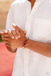 Infused along a stretchy band around the wrist, a strand of colorful glassy, stone, and acrylic beads joins a spotted collection of wood beads for a colorfully urban look. As the stone elements in this piece are natural, some color variation is normal.  Sold as one individual bracelet.