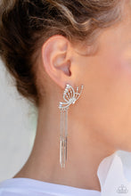 Load image into Gallery viewer, Featuring dainty white rhinestones and dainty marquise-cut iridescent gems, a thin, elongated, airy silver butterfly is titled to the side as if about to take off in flight. A collection of dainty silver rods swings from dainty silver chain tassels at the bottom of the whimsical frame for some free-falling movement. Earring attaches to a standard post fitting. Due to its prismatic palette, color may vary.  Sold as one pair of post earrings.
