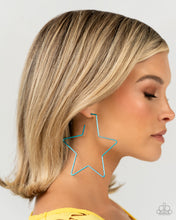 Load image into Gallery viewer, A thin, oversized blue metallic bar delicately folds into a star-shaped hoop, resulting in a stellar statement. Earring attaches to a standard post fitting.  Sold as one pair of hoop earrings.
