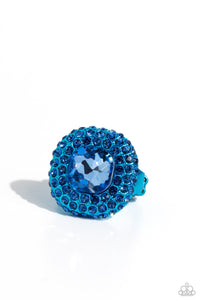 Featuring a regal square cut, an oversized Persian Jewel gem nestles inside a rounded square blue metallic frame encrusted in glassy blue rhinestones for a dramatically glamorous look. Features a dainty stretchy band for a flexible fit.  Sold as one individual ring.