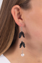 Load image into Gallery viewer, A glossy white pearl delicately links to the bottom of a sleek silver rod. Black acrylic petals cascade along the silver rod, adding a timeless twist to the classic pearl palette. Earring attaches to a standard fishhook fitting. Sold as one pair of earrings.
